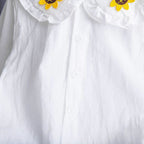 Conjunto de 2 piezas: blusa tejida con cuello decorado y pantalón vaquero.