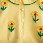 Conjunto de 2 piezas: blusa tejida con cuello decorado y pantalón vaquero.