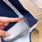 Conjunto de 2 piezas: sudadera con lazo destacado y falda integrada con pantalón.