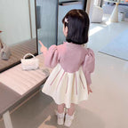 Vestido de invierno cálido con diseño de lazos de satén.