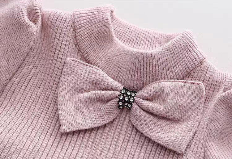 Vestido de invierno cálido con diseño de lazos de satén.