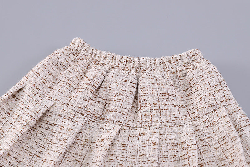 Conjunto de 3 piezas: chaleco de piel, camiseta interior cálida y falda de tweed.