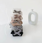 Calcetines largos y cálidos con diseño de lazo clásico