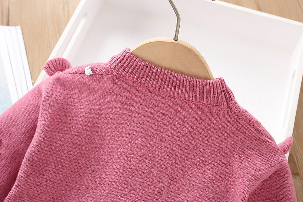 Vestido de niña tejido de invierno de dos piezas: top y falda.