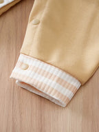 Mono de una sola pieza con botones frontale