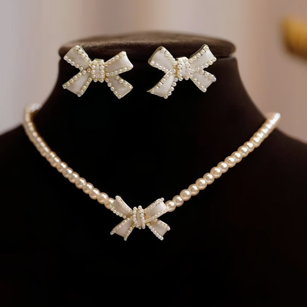Set de joyería para niñas: Collar de perlas con pendientes en forma de lazo