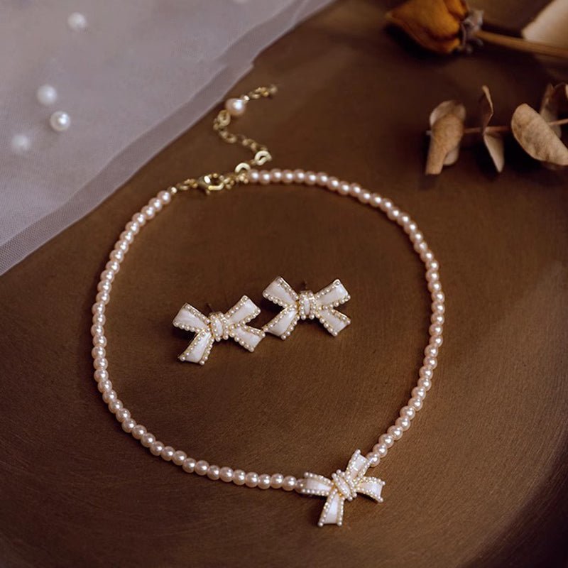 Set de joyería para niñas: Collar de perlas con pendientes en forma de lazo
